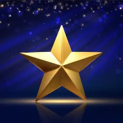 Shiny golden star on a reflective surface with glowing blue background and sparkling lights.